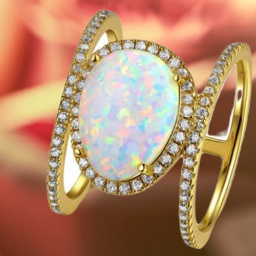White opal and diamond ring in yellow gold